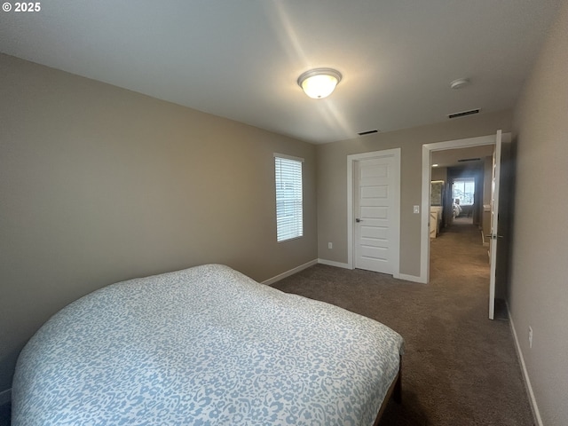 733 NW 178th Way, Ridgefield, WA 98642 - bedroom with visible vents, baseboards, and dark carpet