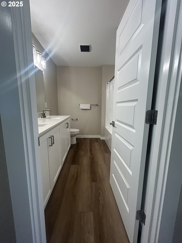 733 NW 178th Way, Ridgefield, WA 98642 - full bath with vanity, visible vents, wood finished floors, toilet, and baseboards