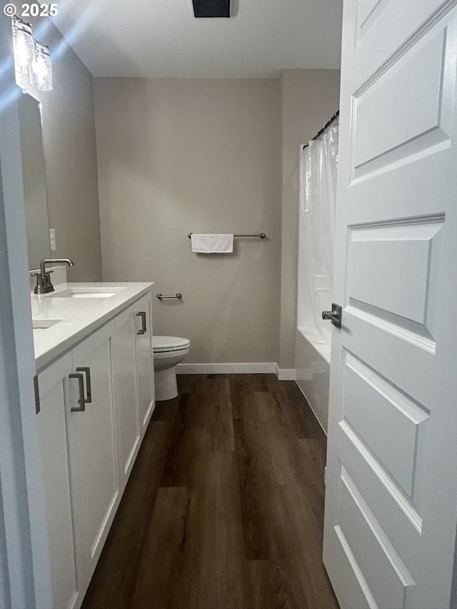 733 NW 178th Way, Ridgefield, WA 98642 - full bathroom with double vanity, wood finished floors, toilet, baseboards, and a sink