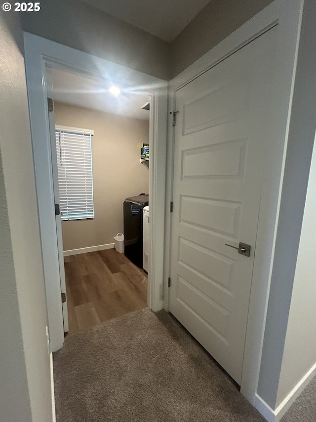 733 NW 178th Way, Ridgefield, WA 98642 - hallway featuring carpet floors, baseboards, wood finished floors, and washing machine and clothes dryer