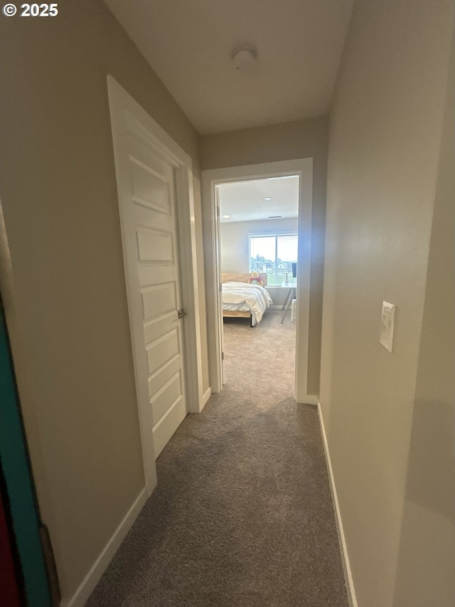 733 NW 178th Way, Ridgefield, WA 98642 - corridor with baseboards and dark carpet