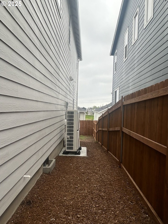 733 NW 178th Way, Ridgefield, WA 98642 - view of side of home featuring ac unit and a fenced backyard