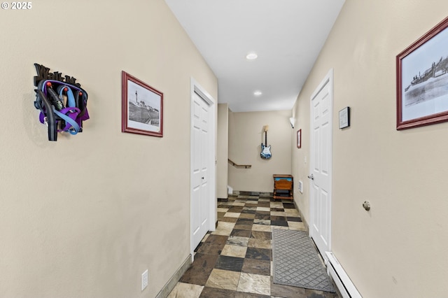 238 SW 27th St, Newport, OR 97365 - hall with baseboards, recessed lighting, and dark stone finish floors