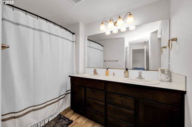 717 S 53rd Pl, Springfield, OR 97478 - full bath featuring double vanity, wood finished floors, and a shower with curtain