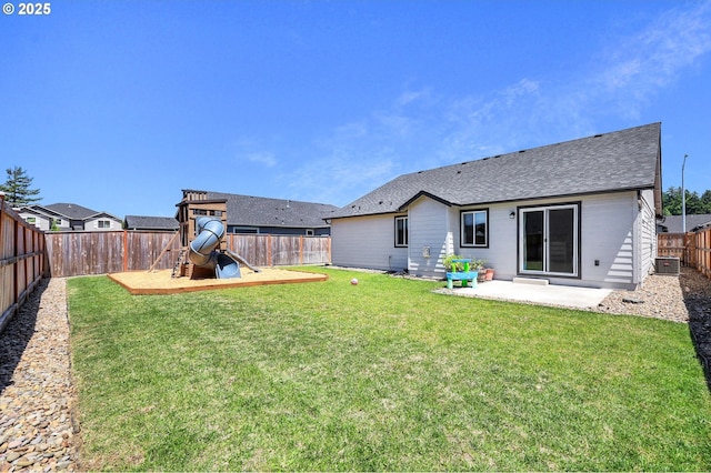 717 S 53rd Pl, Springfield, OR 97478 - back of house featuring a playground, a patio area, a shingled roof, and cooling unit