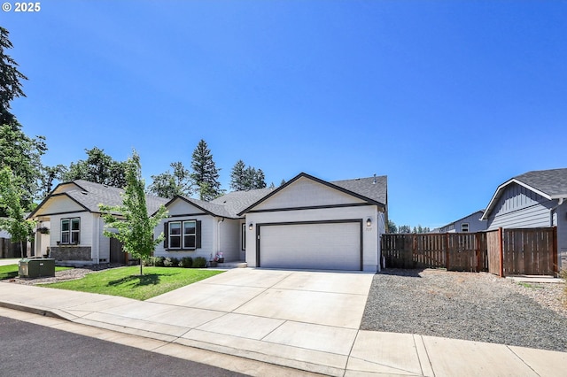 717 S 53rd Pl, Springfield, OR 97478 - ranch-style home featuring an attached garage, concrete driveway, and a shingled roof