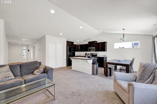 717 S 53rd Pl, Springfield, OR 97478 - living room with recessed lighting, vaulted ceiling, and light colored carpet