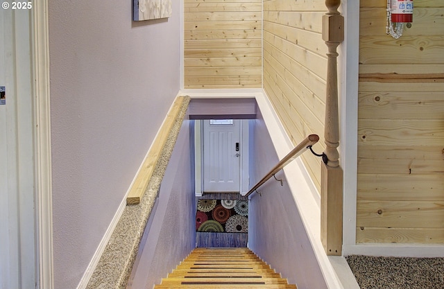 staircase with wooden walls