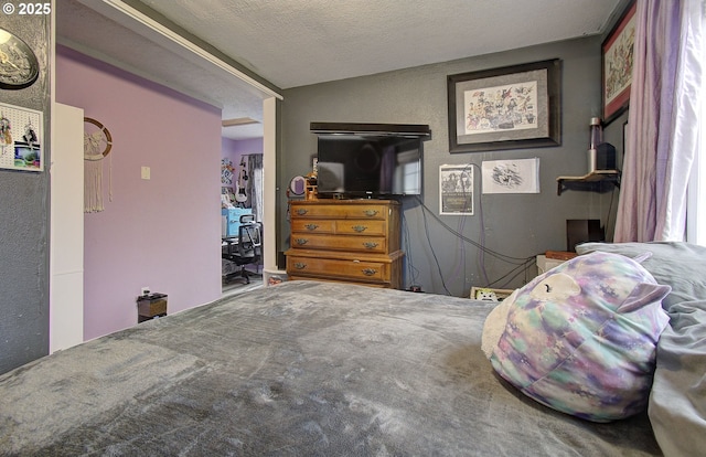 bedroom featuring a textured ceiling