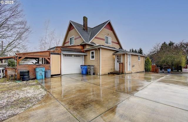 view of side of home featuring a garage