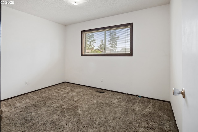 11613 Pacific Ct NE, Woodburn, OR 97071 - carpeted empty room with a textured ceiling and baseboards