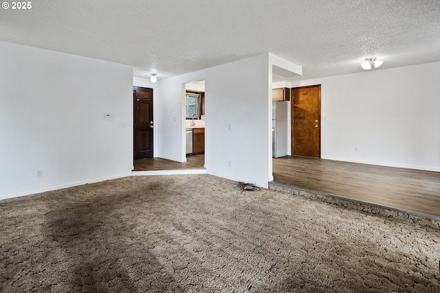 11613 Pacific Ct NE, Woodburn, OR 97071 - unfurnished room with carpet and a textured ceiling