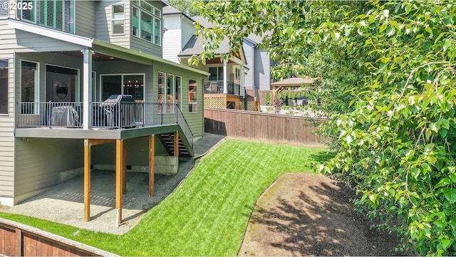 634 NE Province Ct, Camas, WA 98607 - view of yard with stairway, a wooden deck, and a patio
