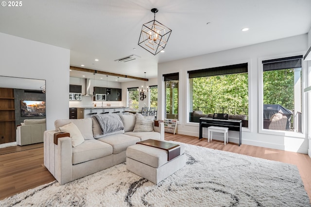 634 NE Province Ct, Camas, WA 98607 - living area featuring a chandelier, wood finished floors, and recessed lighting
