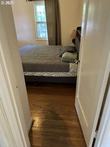 bedroom featuring wood finished floors