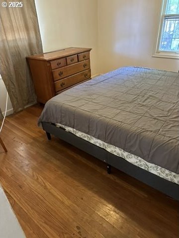 bedroom with wood finished floors