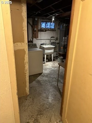 below grade area with washer / clothes dryer and a sink