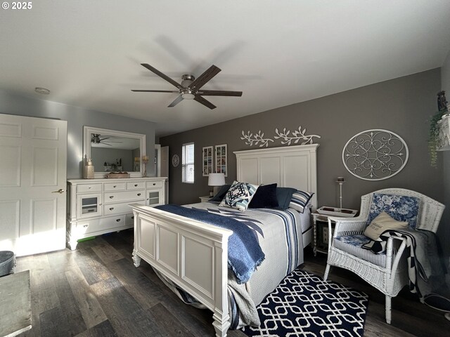 bedroom featuring ceiling fan and dark wood-type flooring