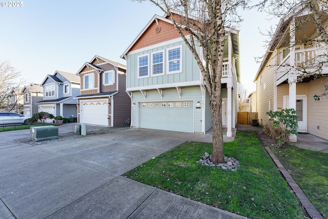 view of front of property with a garage and a front lawn