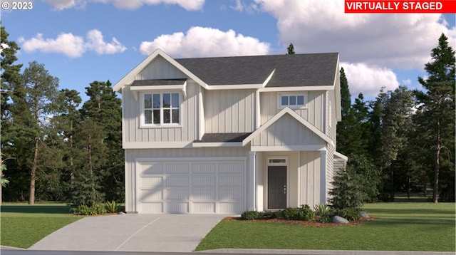 view of front of property featuring a front lawn and a garage