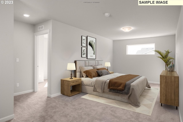 bedroom with light colored carpet