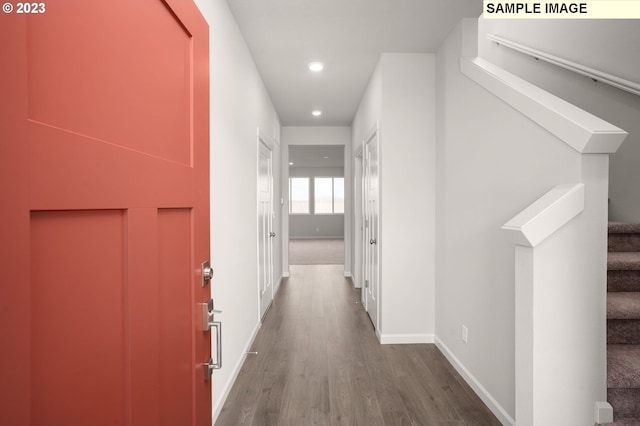 corridor featuring dark wood-type flooring