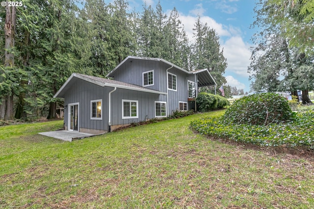 view of property exterior with a lawn