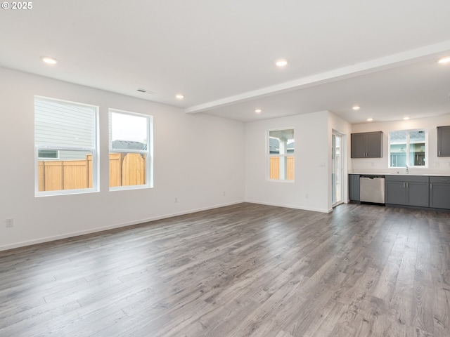 5905 NE 121st Way, Vancouver, WA 98686 - unfurnished living room with recessed lighting, a sink, and wood finished floors