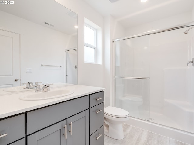 5905 NE 121st Way, Vancouver, WA 98686 - full bathroom with toilet, wood finished floors, a stall shower, visible vents, and vanity