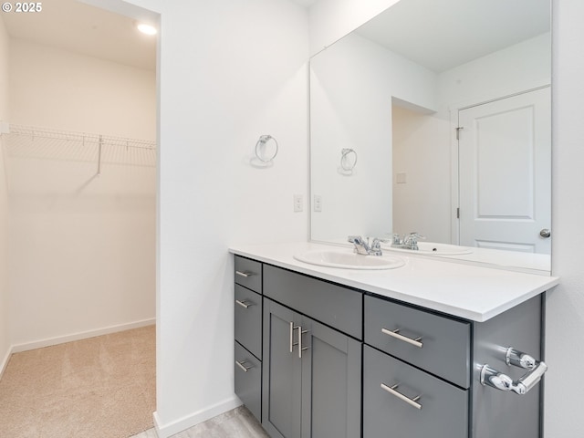 5905 NE 121st Way, Vancouver, WA 98686 - bathroom with baseboards, vanity, and a spacious closet