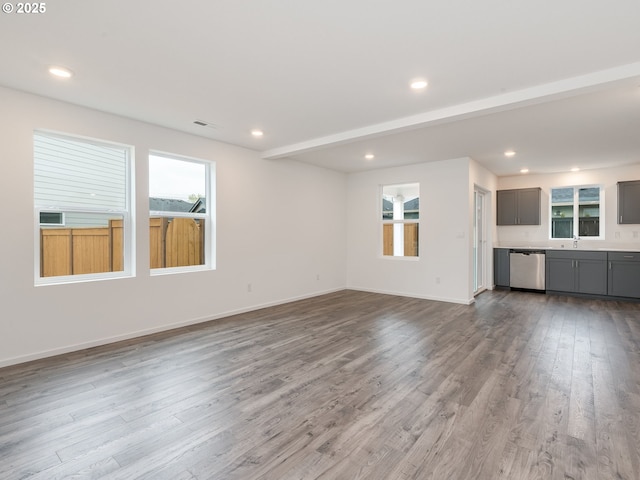 5905 NE 121st Way, Vancouver, WA 98686 - unfurnished living room featuring recessed lighting, baseboards, and wood finished floors