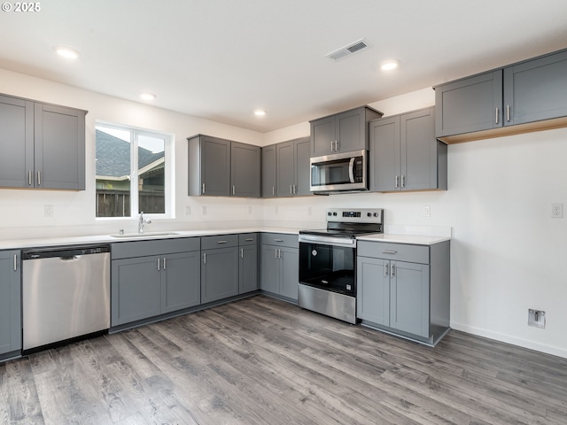 5905 NE 121st Way, Vancouver, WA 98686 - kitchen featuring gray cabinets, visible vents, and appliances with stainless steel finishes