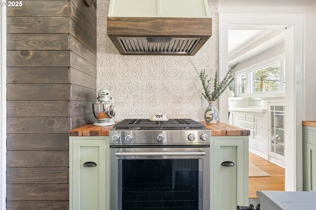 4134 N Concord Ave, Portland, OR 97217 - kitchen featuring wood counters, stainless steel gas range oven, and green cabinets