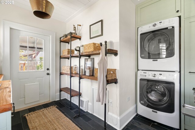4134 N Concord Ave, Portland, OR 97217 - laundry area with baseboards, stacked washer / drying machine, and laundry area