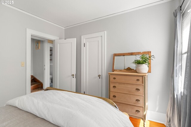 4134 N Concord Ave, Portland, OR 97217 - bedroom featuring crown molding, baseboards, and light wood-type flooring