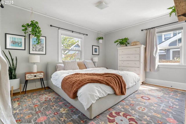 4134 N Concord Ave, Portland, OR 97217 - bedroom with baseboards, ornamental molding, and wood finished floors