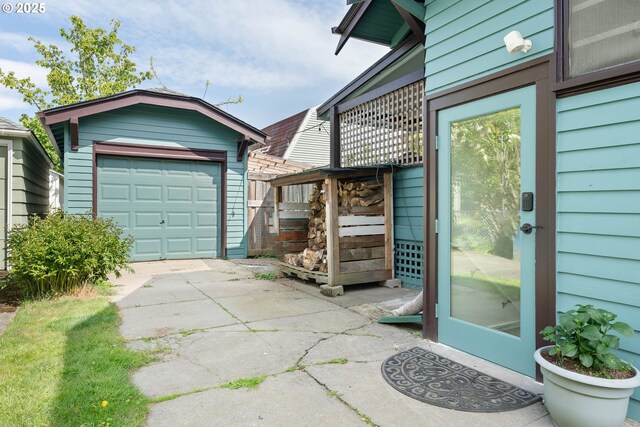 4134 N Concord Ave, Portland, OR 97217 - exterior space featuring an outdoor structure, a garage, and concrete driveway