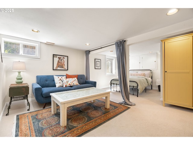 living area with recessed lighting and baseboards