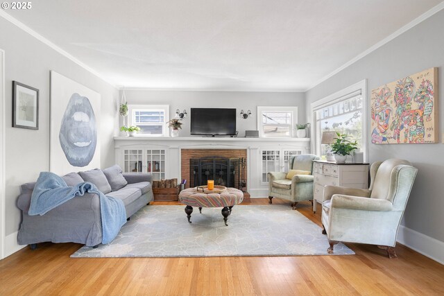 4134 N Concord Ave, Portland, OR 97217 - living area featuring baseboards, ornamental molding, wood finished floors, and a fireplace
