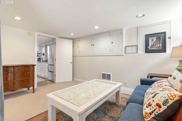 4134 N Concord Ave, Portland, OR 97217 - living area featuring recessed lighting, baseboards, visible vents, and light colored carpet