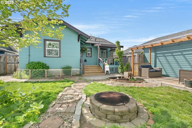 4134 N Concord Ave, Portland, OR 97217 - view of front of property featuring a patio, fence, a fire pit, and a front yard
