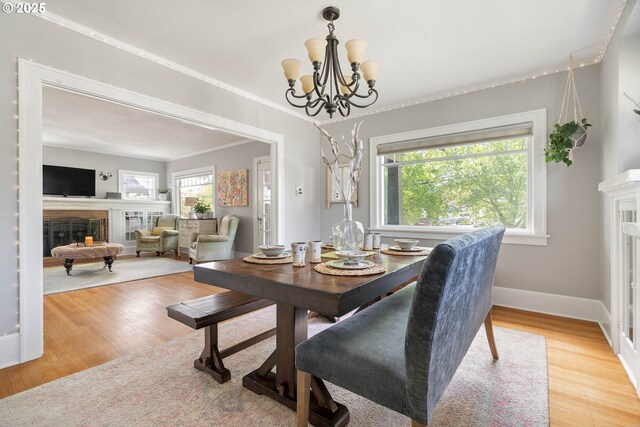 4134 N Concord Ave, Portland, OR 97217 - dining space featuring wood finished floors, a wealth of natural light, and a fireplace