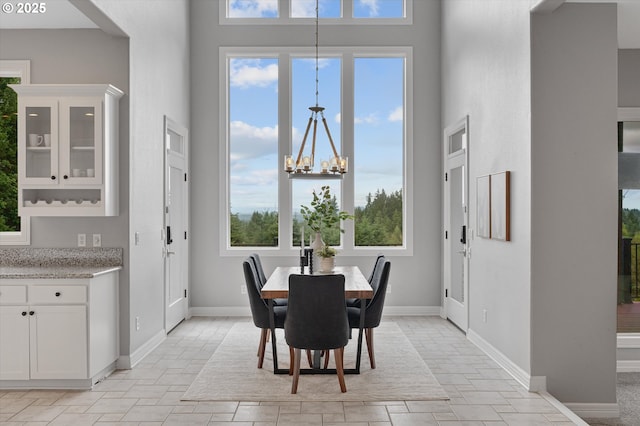 2350 SW Turner Rd, West Linn, OR 97068 - dining space featuring a towering ceiling, a chandelier, and healthy amount of natural light