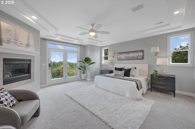 2350 SW Turner Rd, West Linn, OR 97068 - carpeted bedroom featuring a tray ceiling, access to outside, multiple windows, and recessed lighting
