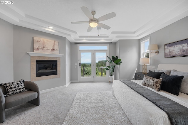 2350 SW Turner Rd, West Linn, OR 97068 - bedroom featuring a raised ceiling, access to outside, carpet flooring, a tile fireplace, and ceiling fan