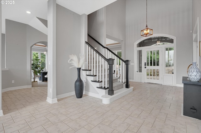 2350 SW Turner Rd, West Linn, OR 97068 - foyer featuring high vaulted ceiling, arched walkways, a chandelier, and stairway