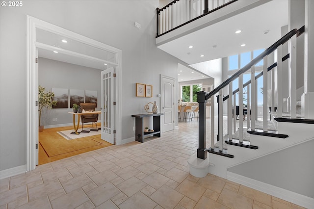 2350 SW Turner Rd, West Linn, OR 97068 - foyer entrance featuring stairs, a towering ceiling, and recessed lighting