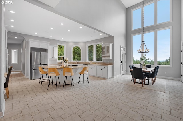 2350 SW Turner Rd, West Linn, OR 97068 - dining area featuring arched walkways, recessed lighting, and a chandelier