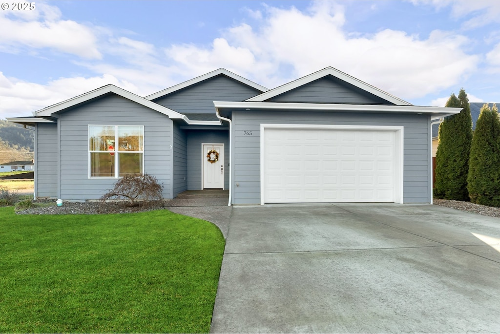 ranch-style house with a front yard and a garage