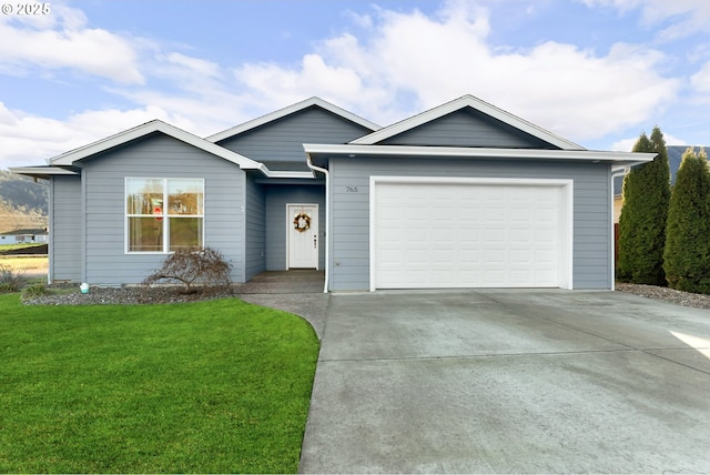 ranch-style house with a front yard and a garage